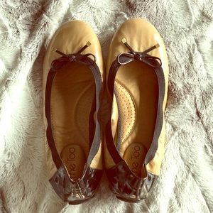 Black and beige flats